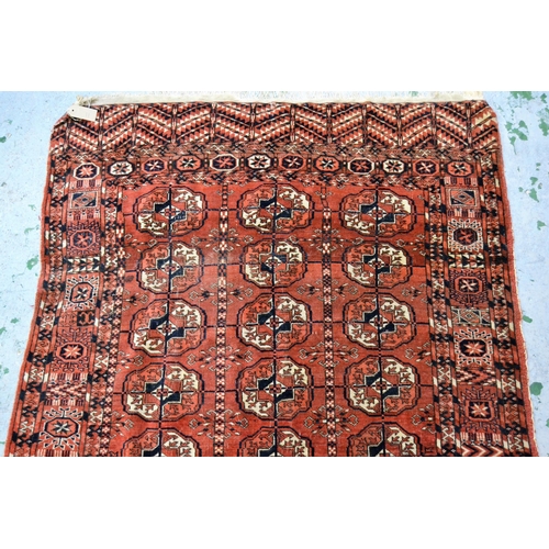 11 - Antique Tekke rug with three rows of eight gols on a wine ground with borders, 159cms x 113cms