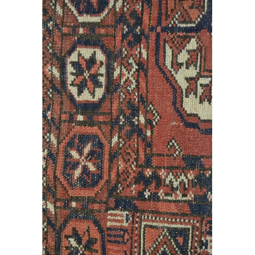 11 - Antique Tekke rug with three rows of eight gols on a wine ground with borders, 159cms x 113cms