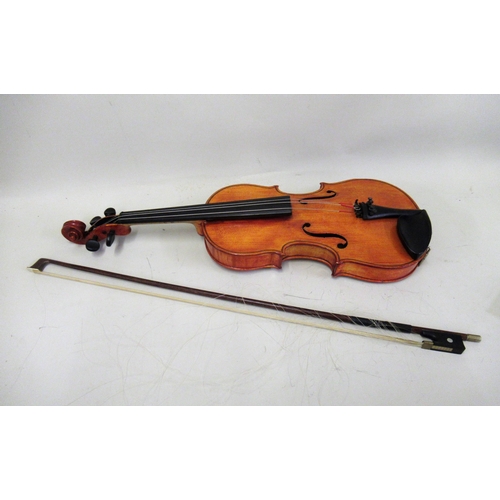 120B - 12.5in Student violin bearing labels with a bow, in an American case by Lifton