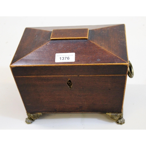 1376 - Regency mahogany line inlaid and brass mounted sarcophagus shaped tea caddy, the hinged cover enclos... 