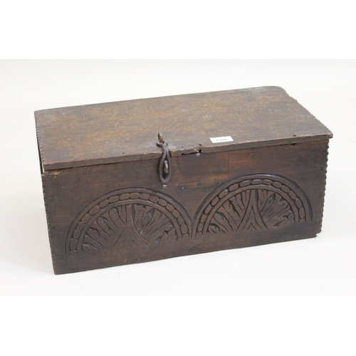 1380 - Small 17th Century oak bible box, the chip carved plank lid above a carved plank front (damages and ... 