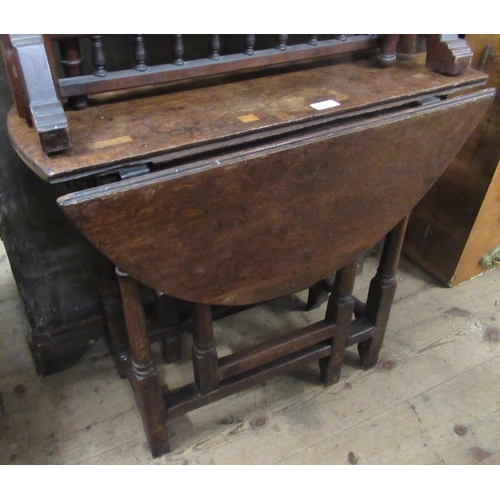 1381 - Small antique oak gateleg table on turned tapering supports with stretchers, 74cms wide