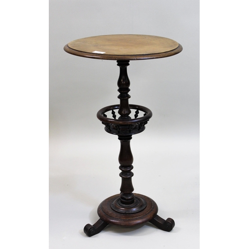 1386 - Victorian walnut circular pedestal table with a turned column support and galleried undertier with t... 