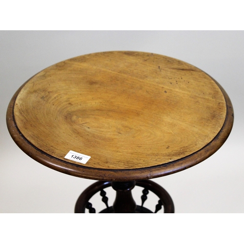 1386 - Victorian walnut circular pedestal table with a turned column support and galleried undertier with t... 