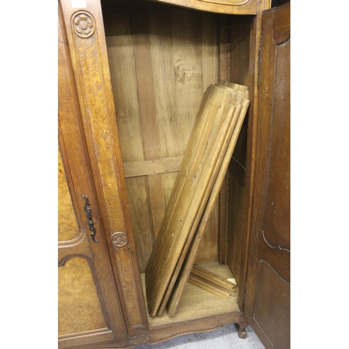 1390 - Early 20th Century French oak and burr elm armoire, the panel doors with carved decorations on cabri... 