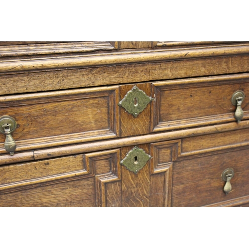 1395 - 18th Century oak two part chest of four long drawers, with geometric moulded fronts with original br... 