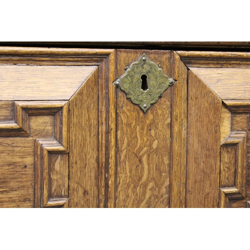 1395 - 18th Century oak two part chest of four long drawers, with geometric moulded fronts with original br... 