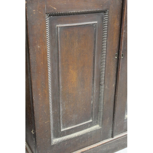 1397 - 19th Century mahogany bookcase, the moulded and carved cornice above two bar glazed doors enclosing ... 