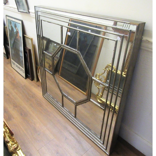 1411 - Oka silver gilt framed segmented wall mirror, 122cms square