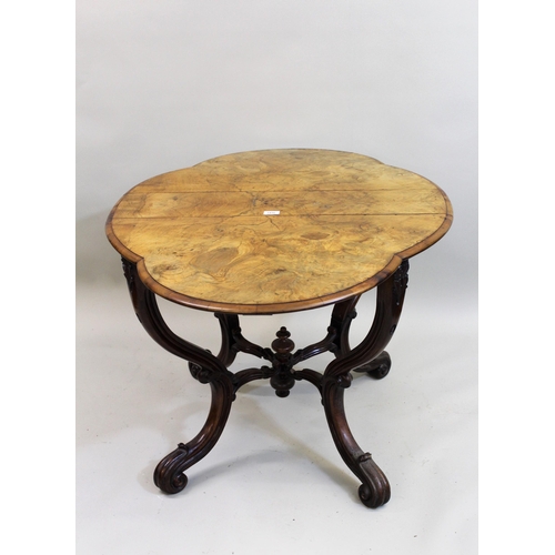 1416 - 19th Century walnut Sutherland table, the shaped oval top raised on unusual carved shaped gateleg su... 