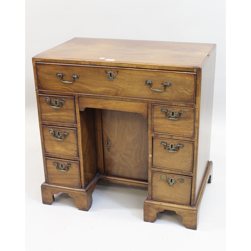 1421 - George III mahogany kneehole desk, the moulded caddy top above seven drawers and centre cupboard, ra... 