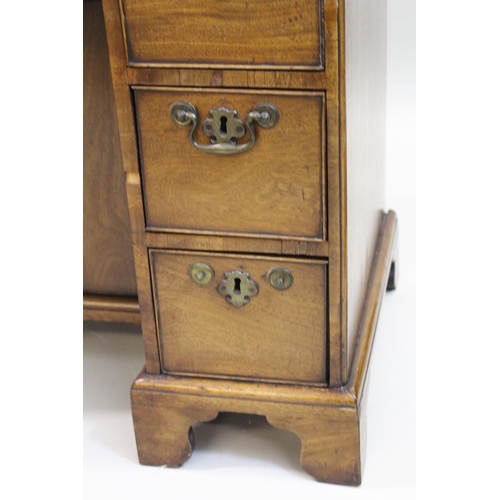 1421 - George III mahogany kneehole desk, the moulded caddy top above seven drawers and centre cupboard, ra... 