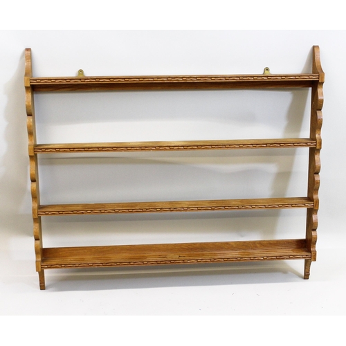 1422 - Peter Hall of Staveley, 20th Century Arts and Crafts oak four shelf plate rack, 92cms high x 107cms ... 