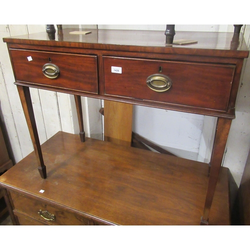 1428 - 19th Century mahogany side table, with crossbanded top above two drawers with oval brass handles on ... 