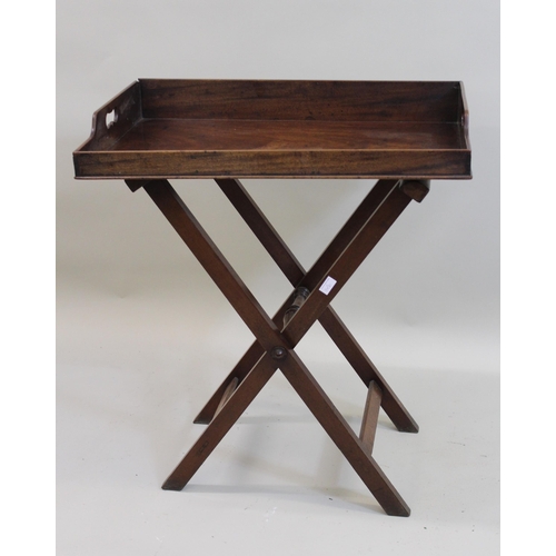 1430 - Two 19th Century mahogany rectangular butlers trays with folding stands, the largest 78cms wide