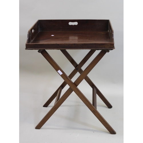 1430 - Two 19th Century mahogany rectangular butlers trays with folding stands, the largest 78cms wide