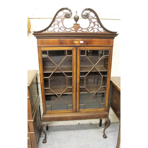 1450 - Mahogany and line inlaid cabinet on stand, the pierced fretwork surmount above a pair of astragal gl... 