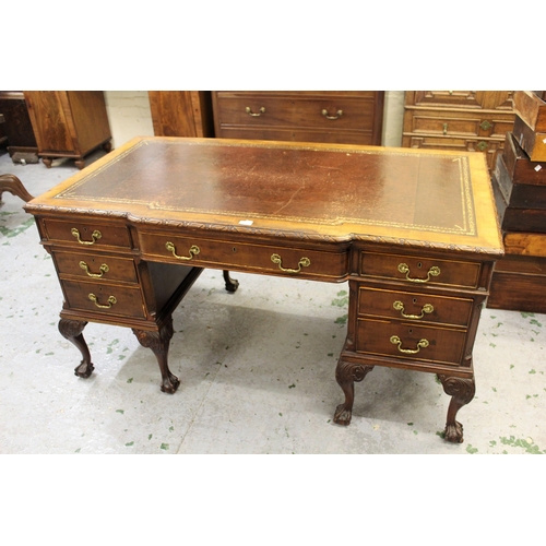 1466 - 1920's Mahogany semi bow fronted pedestal desk having brown leather and gilt tooled inset top, above... 