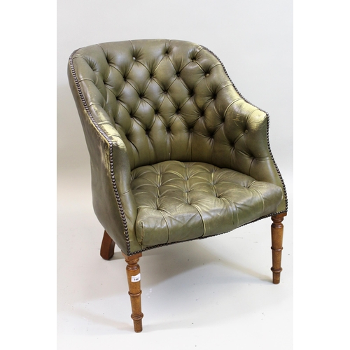 1467 - 20th Century green button leather upholstered tub shaped armchair on turned tapering front supports