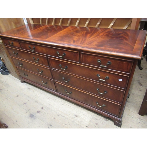 1484 - Reproduction mahogany crossbanded and line inlaid low chest of nine drawers, with brass swan neck ha... 