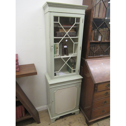 1489 - Mid 20th Century narrow bookcase with moulded cornice above a single astragal glazed door and panell... 