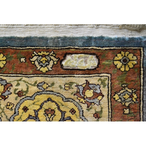 15 - Hereke silk prayer rug with an all-over floral design of with figures of birds and multiple borders ... 