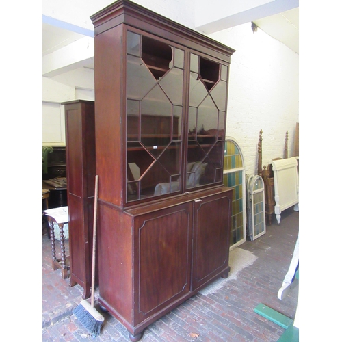 1526 - 19th Century mahogany bookcase, the moulded cornice above two glazed doors (with damages) and two fl... 