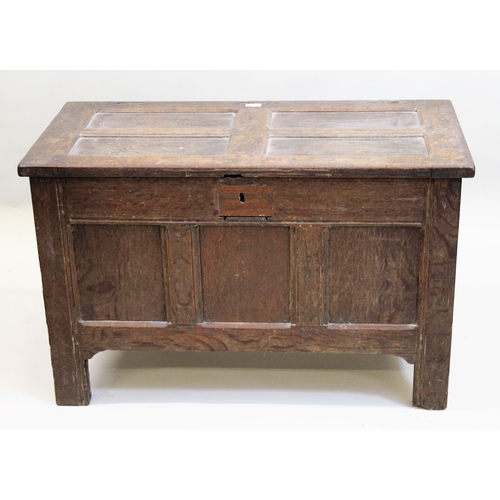 1535 - Small antique oak coffer, the panelled top above three panel front raised on stile feet, together wi... 