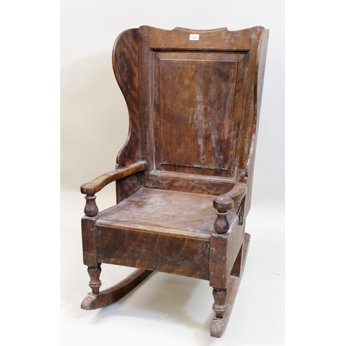 1536 - 19th Century fruitwood rocking lambing chair, with panelled back and seat above a later side drawer,... 