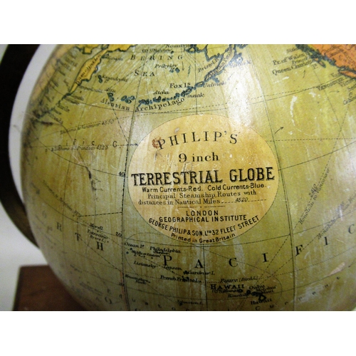 155 - Philips 9in terrestrial globe on stand, the mahogany rectangular base housing an atlas, 44cms high