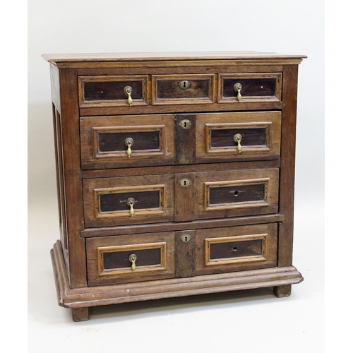 1551 - Small oak moulded front chest of four long drawers, raised on low stile feet (17th Century and later... 