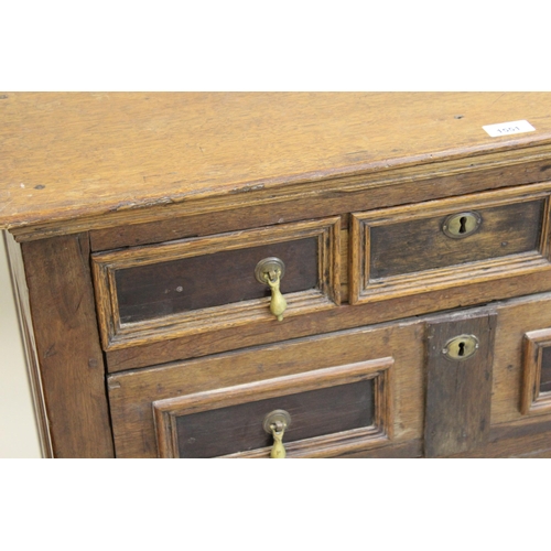 1551 - Small oak moulded front chest of four long drawers, raised on low stile feet (17th Century and later... 