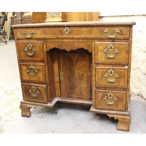 1552 - 18th Century walnut and crossbanded kneehole desk, with a single long drawer and six small drawers a... 