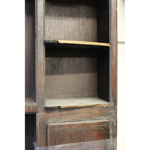 1555 - 18th Century oak dresser, the boarded shelf back with two cupboard doors, the base with three drawer... 