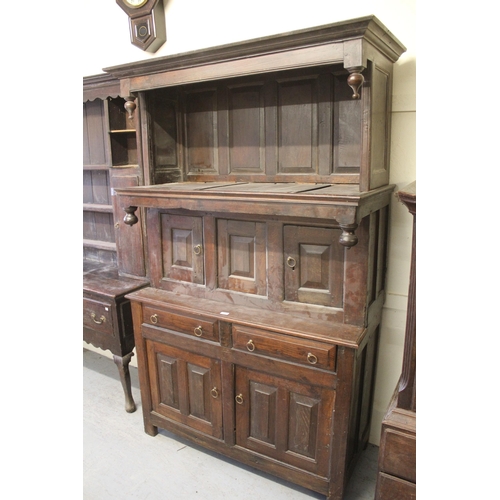 1556 - 17th Century and later Welsh oak Tridarn with a later open canopy and three panelled doors, two draw... 