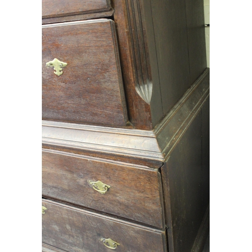 1557 - Small 18th Century oak chest on chest, the moulded cornice above two short and four long drawers wit... 