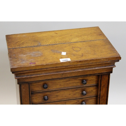 1566 - 19th Century oak Wellington type table chest of ten drawers, on a shaped moulded plinth base