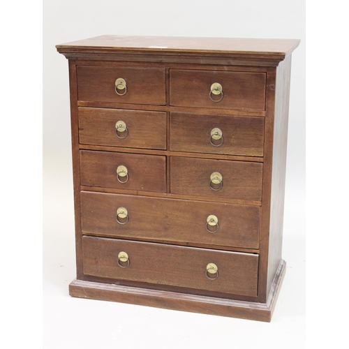 1568 - Mahogany table chest of six short and two long drawers with brass ring handles, on a plinth base