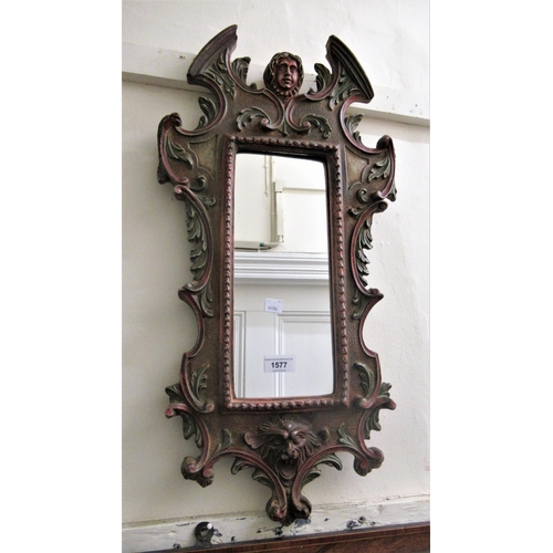 1577 - Continental carved pine wall mirror with painted finish, 63cms hgh