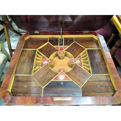 1592 - 19th Century feathered mahogany octagonal work table, the hinged cover enclosing a fully fitted inte... 