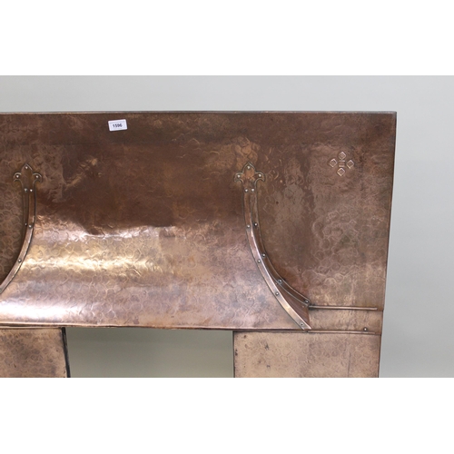 1596 - Arts & Crafts beaten copper fire surround with integral hood, with strapwork decoration, 109cms wide... 