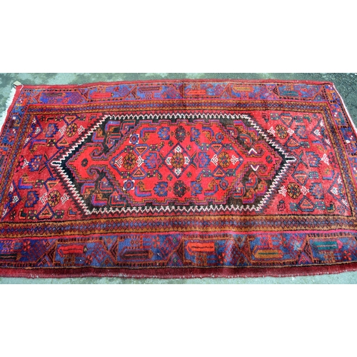 16 - Hamadan rug of all-over floral geometric design with multiple borders on a wine red ground, 218cms x... 