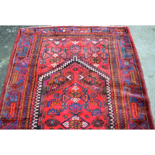 16 - Hamadan rug of all-over floral geometric design with multiple borders on a wine red ground, 218cms x... 