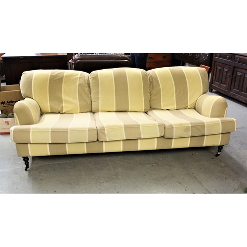 1600 - Modern Victorian style three seat sofa, upholstered in contemporary beige stripe fabric on turned fr... 