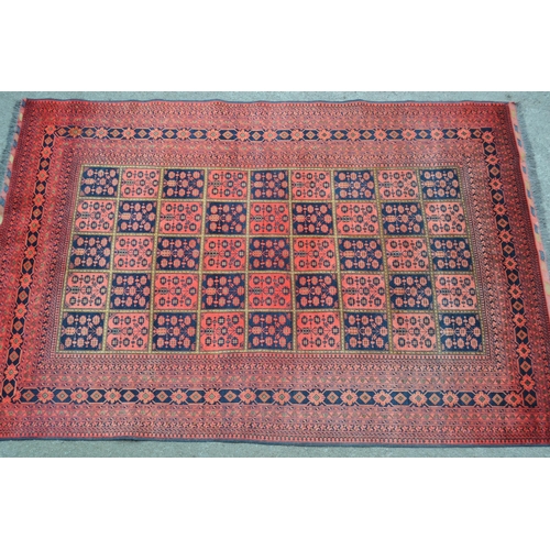 19 - Modern Afghan Belouch carpet with an all-over tile pattern design and multiple borders, 290cms x 196... 