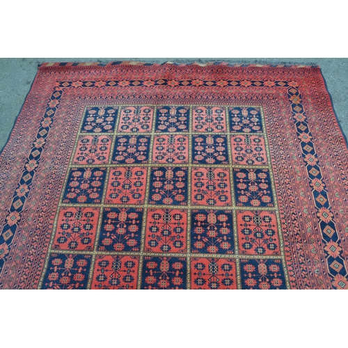 19 - Modern Afghan Belouch carpet with an all-over tile pattern design and multiple borders, 290cms x 196... 