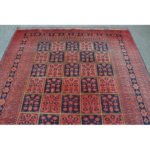 19 - Modern Afghan Belouch carpet with an all-over tile pattern design and multiple borders, 290cms x 196... 