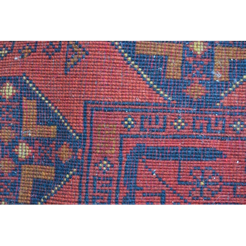 21 - Afghan Belouch rug with two rows of three gols on wine ground with borders, 193cms x 125cms approxim... 