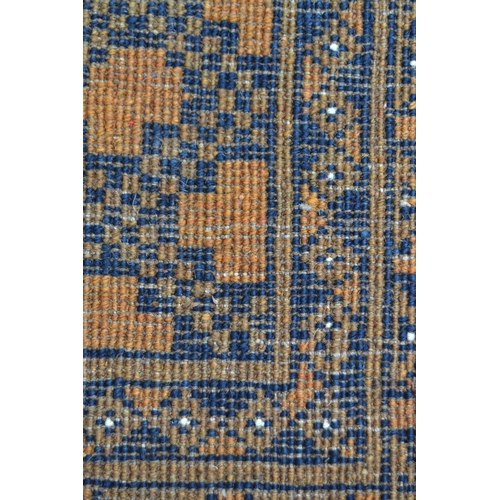 27 - Afghan gold ground carpet with three rows of eight gols within a multiple border, 290cms x 210cms