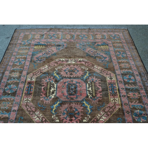 28 - Bastan carpet with a medallion and stylised floral design on a fawn ground, in shades of rose, blue,... 